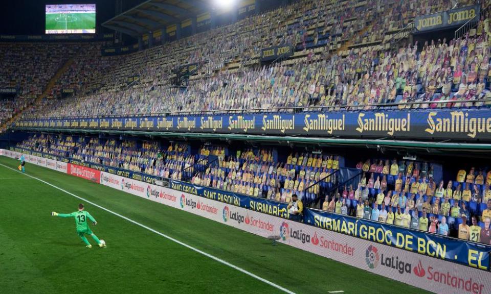 Jan Oblak clears in front of a stand full of cardboard cutouts.