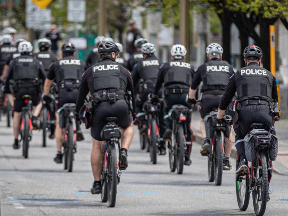 A group of Ottawa police officers are seen during a bicycle training session on Elgin Street last spring. (Brian Morris/CBC - image credit)