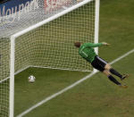 FILE -In this June 27, 2010 file photo, Germany goalkeeper Manuel Neuer looks at the ball that hit the bar to bounce over the line during the World Cup round of 16 soccer match between Germany and England at Free State Stadium in Bloemfontein, South Africa. Back at the World Cup, this time in the round of 16 in South Africa, the two teams produced five goals but the match is best remembered for the one that didn't count. (AP Photo/Alessandra Tarantino, File)