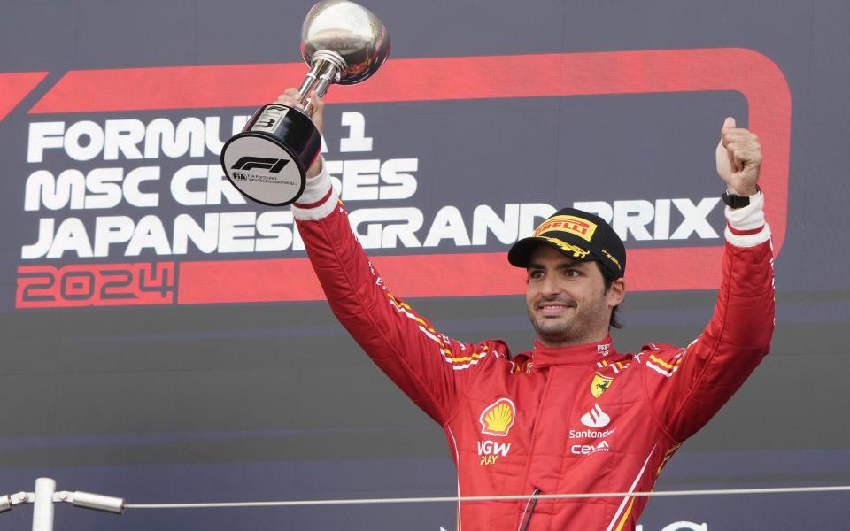 Third place Scuderia Ferrari driver Carlos Sainz Jr. of Spain celebrates with his trophy on the podium after the Formula One Japanese Grand Prix at the Suzuka International Racing Course in Suzuka, Japan, 07