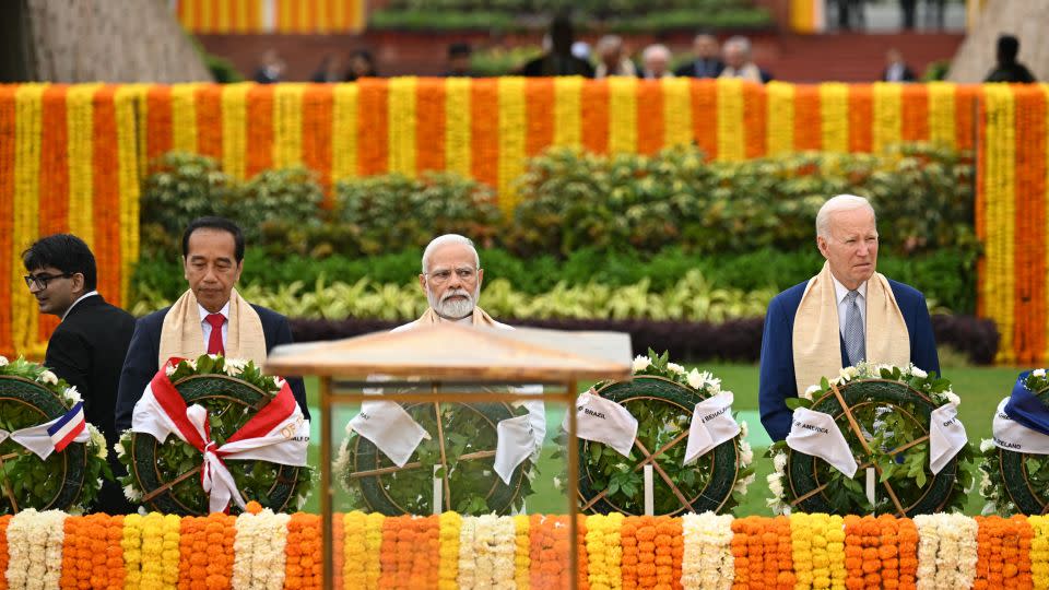 Indonesia's President Joko Widodo, India's Prime Minister Narendra Modi and US President Joe Biden at the Mahatma Gandhi memorial at Rajghat in New Delhi on September 10, 2023.  - Kenny Holston/Pool/AFP/Getty Images