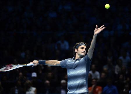 Roger Federer of Switzerland serves to Rafael Nadal of Spain during their men's singles semi-final tennis match at the ATP World Tour Finals at the O2 Arena in London November 10, 2013. REUTERS/Dylan Martinez