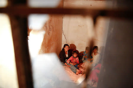 Refugees who fled fighting in neighbouring Myanmar find shelter in the house of a relative in the village of Baiyan near Nansan in the Yunnan province, China, March 11, 2017. REUTERS/Thomas Peter