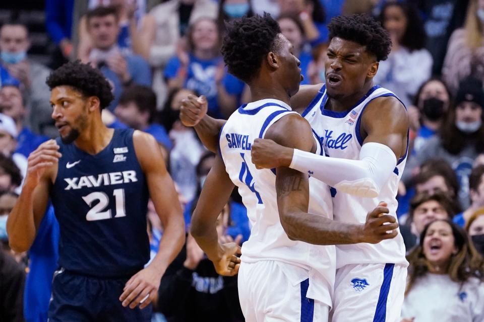 Seton Hall's Alexis Yetna, right, and forward Tyrese Samuel celebrate after Yetna scoree and drew a foul during the first half of the team's NCAA college basketball game against Xavier,