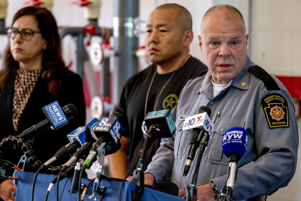 Pa. State Police deputy commissioner of operations Lt. Col. George Bivens, right, updates the news media at the Po-Mar-Lin Fire Company in Kennett Square Tuesday, Sept.12, 2023 as the search for escaped convict Danelo Cavalcante continues in northern Chester County. (Tom Gralish/The Philadelphia Inquirer via AP)