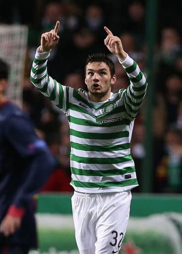 Celtic's Scottish striker Tony Watt celebrates scoring during their UEFA Champions League Group G football match at Celtic Park in Glasgow. Celtic won 2-1. A