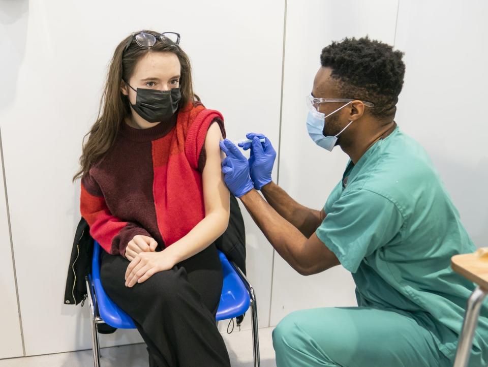 An associate practitioner administers a coronavirus vaccine at Elland Road in Leeds (Danny Lawson/PA)