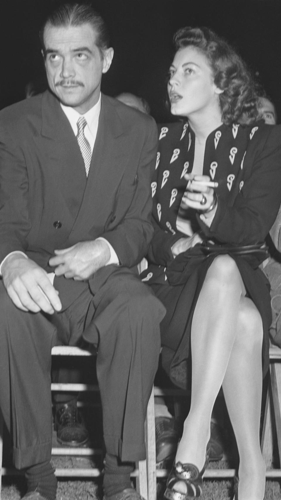 Movie producer and aviation executive Howard Hughes and Ava Gardner are shown at ringside during the title bout between Heavyweight champion Joe Louis and Tami Mauriello in Yankee Stadium