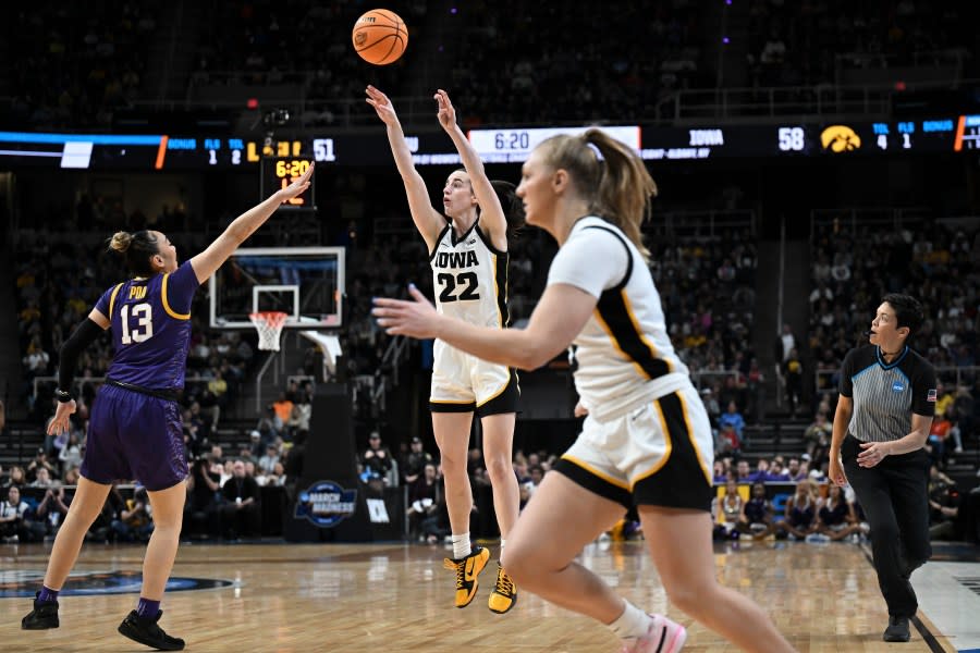Iowa guard Caitlin Clark (22) puts up a three-point shot against LSU during the third quarter of an Elite Eight round college basketball game during the NCAA Tournament, Monday, April 1, 2024, in Albany, N.Y. (AP Photo/Hans Pennink)