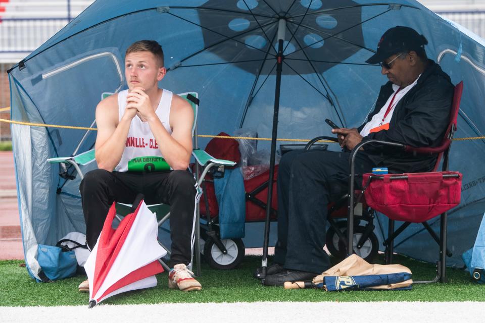 Annville-Cleona's Rogan Carter looks out as rain continues to fall at the PIAA District 3 Track and Field Championships on Friday, May 20, 2022, at Shippensburg University. 