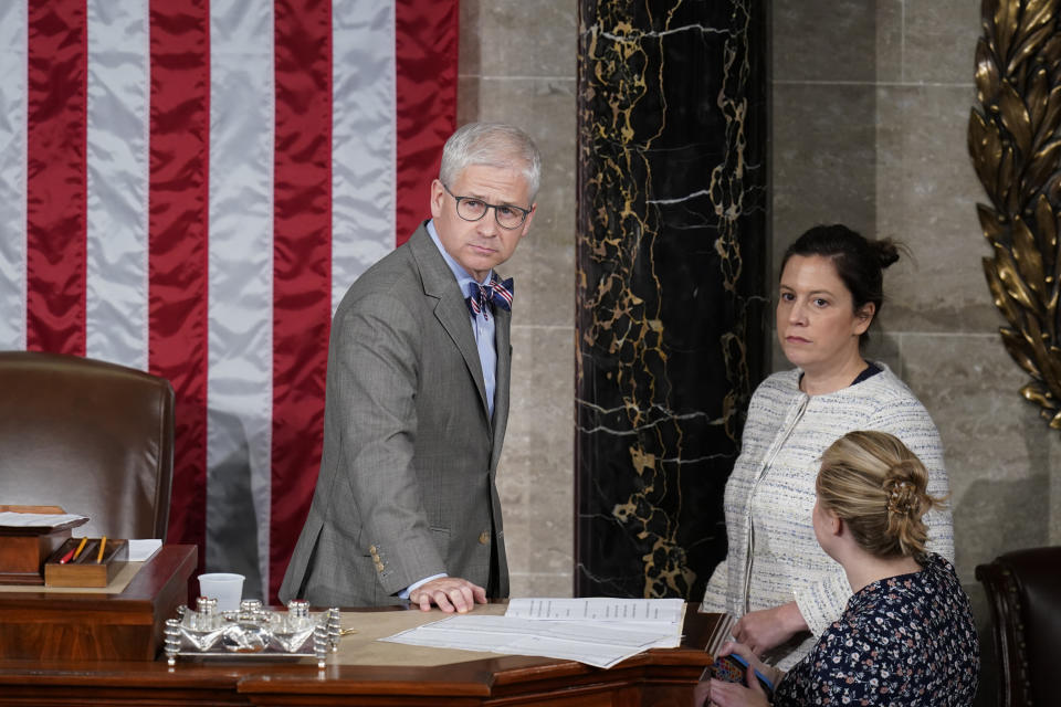 FILE - Rep. Patrick McHenry, R-N.C., the temporary leader of the House of Representatives and the speaker pro tempore, stands with Rep. Elise Stefanik, R-N.Y., as votes are tallied as Republicans try to elect Rep. Jim Jordan, R-Ohio, a top Donald Trump ally, to be the new House speaker, at the Capitol in Washington, Friday, Oct. 20, 2023. McHenry, who presided temporarily over the U.S. House for three intense weeks while Republicans struggled to elect a permanent speaker after Kevin McCarthy's ouster, announced on Tuesday, Dec. 5, that he won't seek reelection to his seat next year. (AP Photo/Alex Brandon, File)