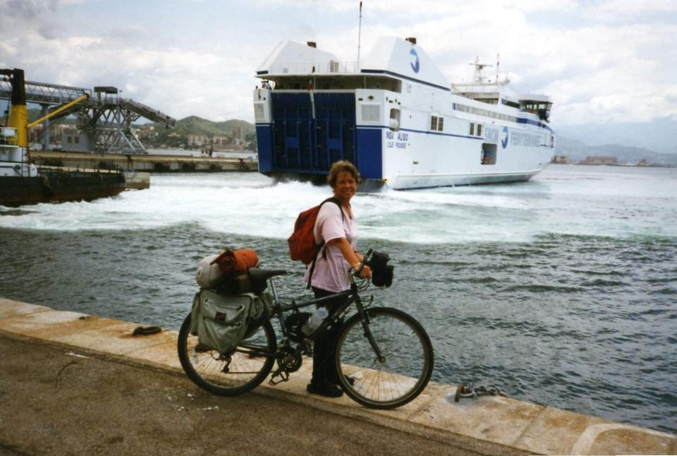 Louisa Rogers with a bicycle before getting on a ferry.