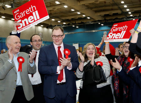 Labour party candidate Gareth Snell (3rd L) celebrates with his wife Sophia after winning the Stoke Central by-election in Stoke on Trent, February 24, 2017. REUTERS/Darren Staples