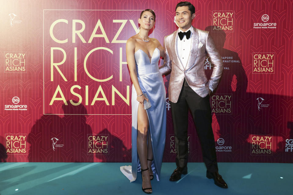 <p>British-Malaysian actor Henry Golding and wife Liv Lo pose for photographers at the Singapore premiere of ‘Crazy Rich Asians’ on 21 August 2018. (PHOTO: Yahoo Lifestyle Singapore) </p>