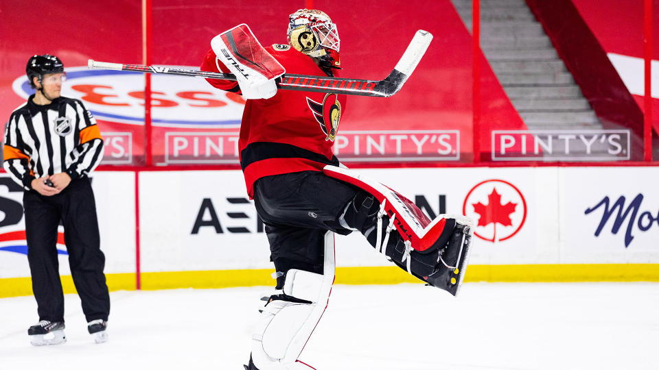 Joey Daccord celebrates his first career NHL win after beating the Maple Leafs. (Photo by Richard A. Whittaker/Icon Sportswire via Getty Images)