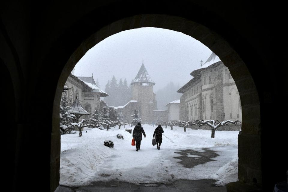 Local people leave after a Romanian Orthodox mass (Reuters)