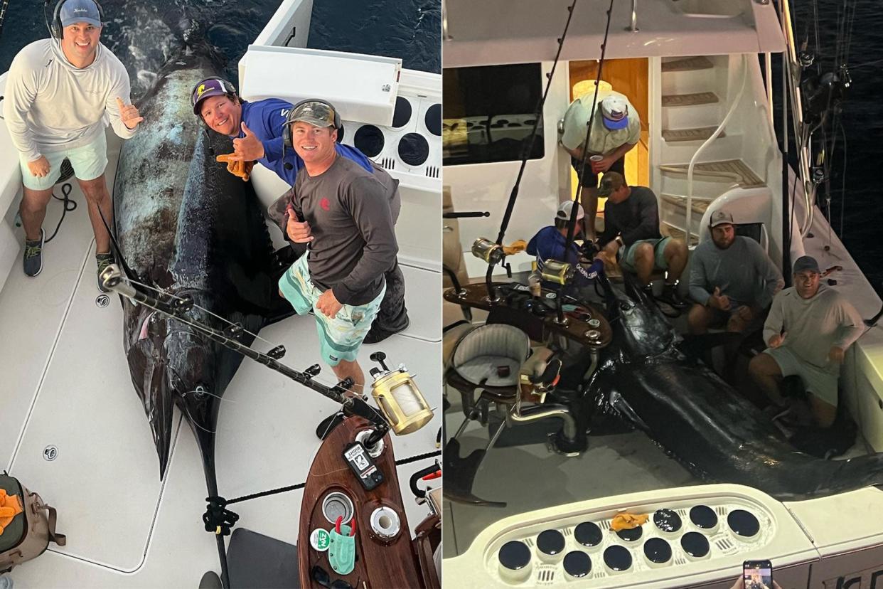 A crew of fisherman pose with a state record marlin caught in the Gulf of Mexico.