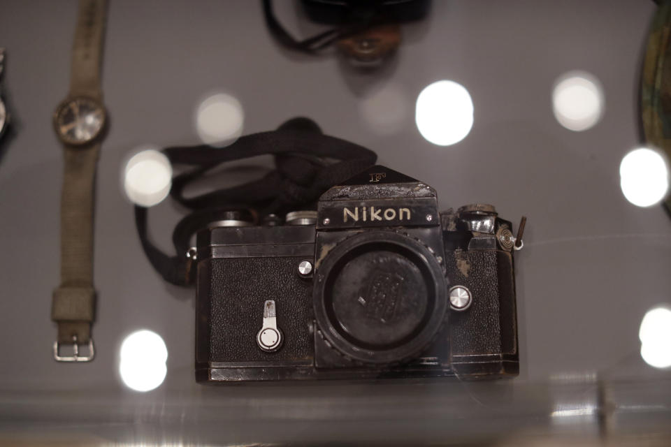 Veteran British conflict photographer Don McCullin's Nikon F camera that was hit by a bullet in Cambodia is displayed at the launch of his retrospective exhibition at the Tate Britain gallery in London, Monday, Feb. 4, 2019. The exhibition includes over 250 of his black and white photographs, including conflict images from the Vietnam war, Northern Ireland, Cyprus, Lebanon and Biafra, alongside landscape and still life images. (AP Photo/Matt Dunham)