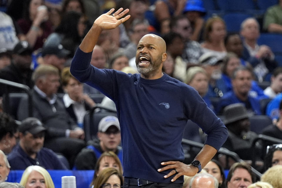 Orlando Magic head coach Jamahl Mosley directs his players against the Milwaukee Bucks during the second half of an NBA basketball game, Sunday, April 14, 2024, in Orlando, Fla. (AP Photo/John Raoux)