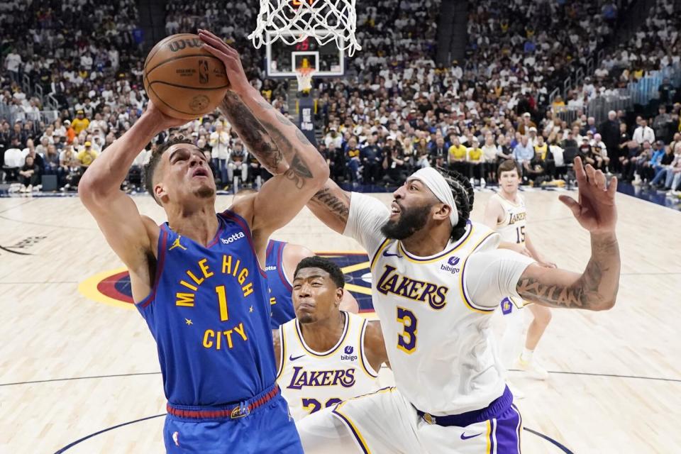 Nuggets forward Michael Porter Jr. goes up to shoot against Lakers forward Anthony Davis.