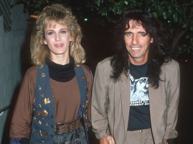 <p>Photo by Ron Galella, Ltd./Ron Galella Collection/Getty</p> Sheryl Cooper and Alice Cooper at Spago Restaurant on Dec. 6, 1986, in West Hollywood