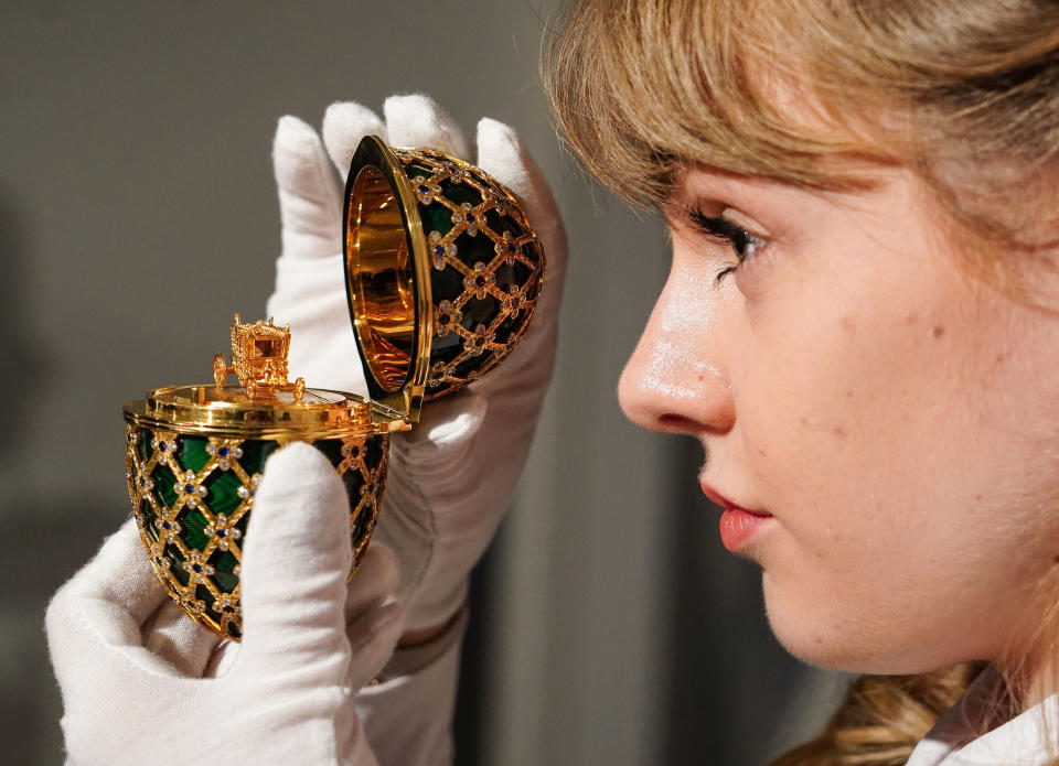 A gold-plated and Swarovski-encrusted prop egg commissioned from Asprey, in the style of Faberge from the James Bond film Octopussy. (PA)