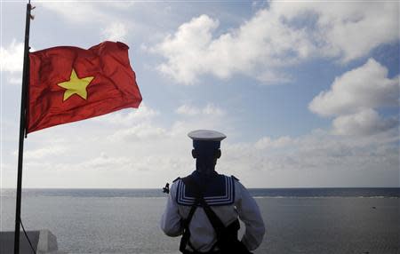 A Vietnamese naval soldier stands guard at Thuyen Chai island in the Spratly archipelago in this January 17, 2013 file photo. REUTERS/Quang Le/Files