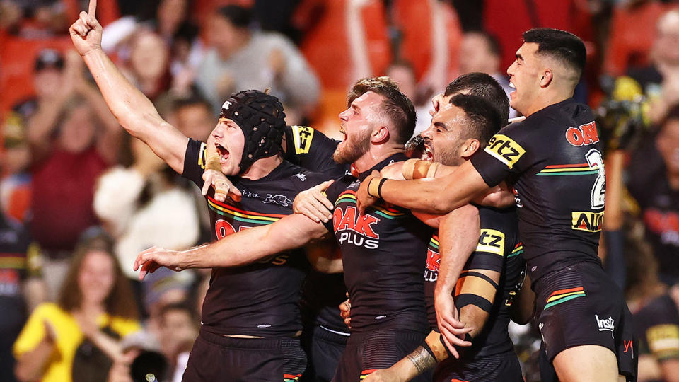 Penrith players are seen celebrating their epic win over Melbourne.