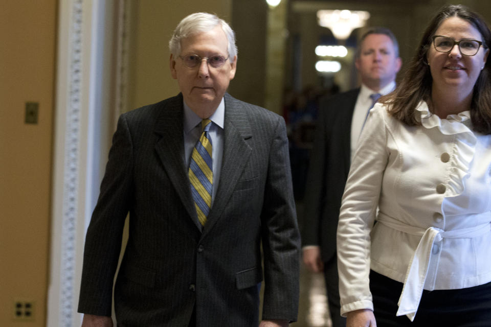 Senate Majority Leader Mitch McConnell, R-Ky., walks from his office to the Senate chamber, on Capitol Hill in Washington, Tuesday, Jan. 14, 2020. (AP Photo/Jose Luis Magana)