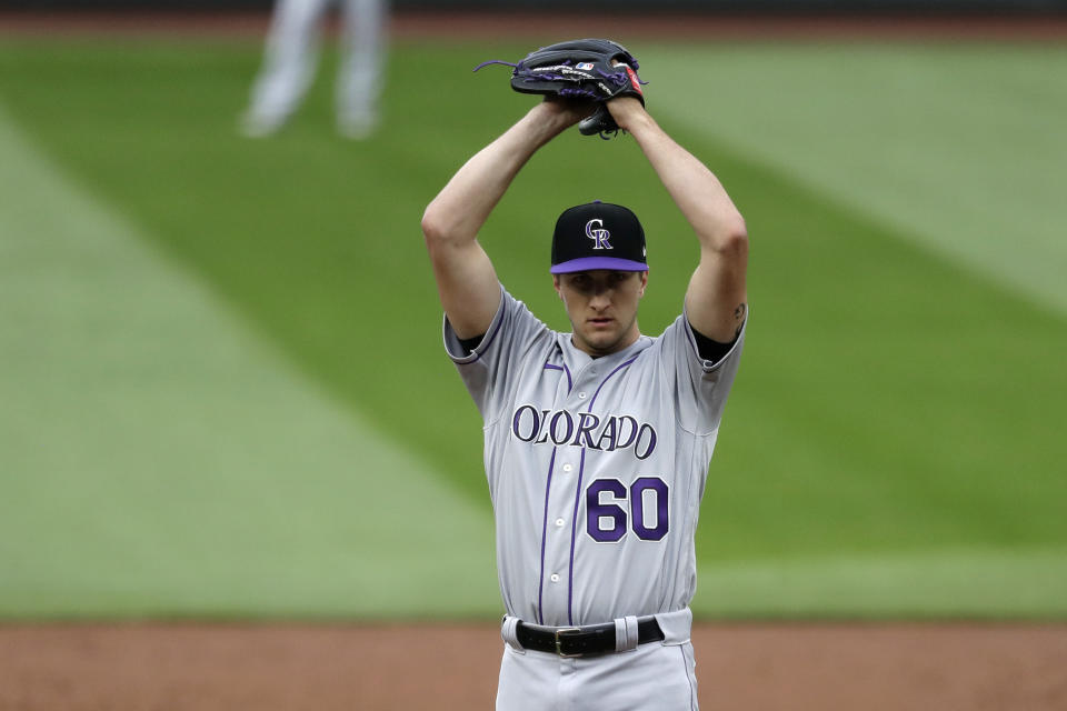 Colorado Rockies starting pitcher Ryan Castellani stretches before throwing against the Seattle Mariners in the third inning of a baseball game Saturday, Aug. 8, 2020, in Seattle. (AP Photo/Elaine Thompson)