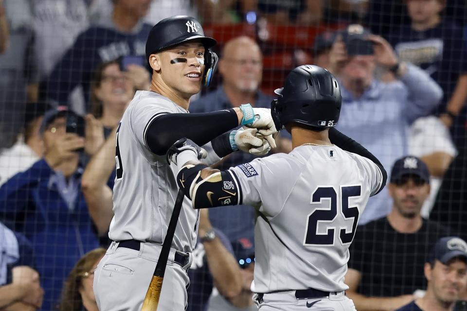 New York Yankees' Aaron Judge celebrates his grand slam against the Boston Red Sox with Gleyber Torres (25) during the second inning of the second game of a baseball doubleheader in Boston, Thursday, Sept. 14, 2023. (AP Photo/Michael Dwyer)