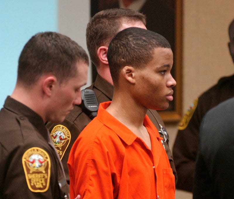 Lee Boyd Malvo listens to court proceedings during the trial of fellow sniper suspect John Allen Muhammad in Virginia Beach, Va., Oct. 20, 2003. Virginia has denied parole to convicted sniper killer Malvo, ruling that he is still a risk to the community two decades after he and his partner terrorized the Washington, D.C., region with a series of random shootings. The Virginia Parole Board rejected his request on Aug. 30, 2022.