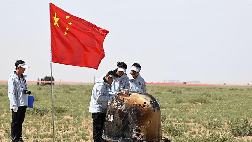 China Aerospace Administration technicians inspect the sample capsule  CNSA