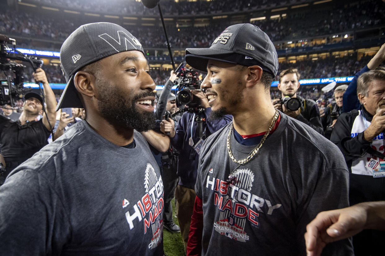 Jackie Bradley Jr. (left) and Mookie Betts of the Boston Red Sox celebrate after winning the 2018 World Series. (Photo by Billie Weiss/Boston Red Sox/Getty Images)