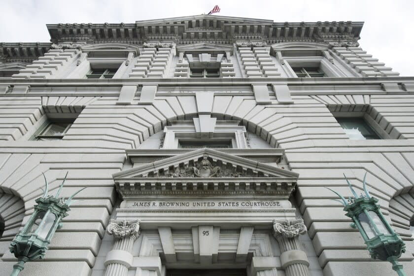 The James R. Browning United States Courthouse building, a courthouse for the 9th U.S. Circuit Court of Appeals, is shown in San Francisco on Jan. 8, 2020. A federal appeals court agreed Tuesday, Dec. 15, 2020, with two Nevada churches that have argued for months that the state's COVID-19 restrictions are unconstitutional because they place harsher attendance limits on religious gatherings than casinos and other secular businesses. The court reversed earlier federal court rulings that upheld Nevada's hard cap on the size of indoor worship services. (AP Photo/Jeff Chiu)