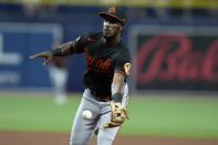 Baltimore Orioles shortstop Jorge Mateo flips the ball with his glove to first base in time to throw out Tampa Bay Rays' Brandon Lowe during the fourth inning of a baseball game Friday, Aug. 12, 2022, in St. Petersburg, Fla. (AP Photo/Chris O'Meara)