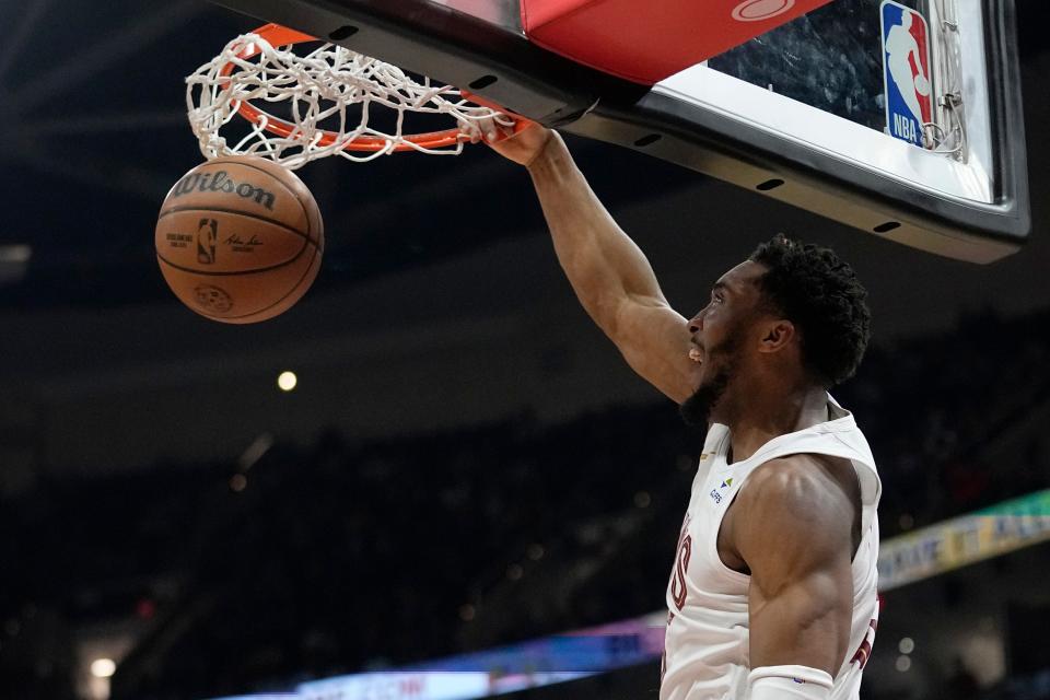 Cleveland Cavaliers guard Donovan Mitchell dunks in the second half of an NBA basketball game against the Sacramento Kings, Monday, Feb. 5, 2024, in Cleveland. (AP Photo/Sue Ogrocki)