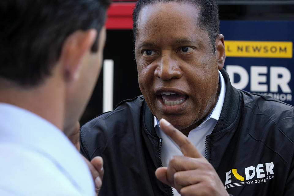 Republican conservative radio show host Larry Elder argues with a TV reporter during an interview after visiting Philippe The Original Deli during a campaign for the California gubernatorial recall election on Monday, Sept. 13, 2021, in Los Angeles. (AP Photo/Ringo H.W. Chiu)