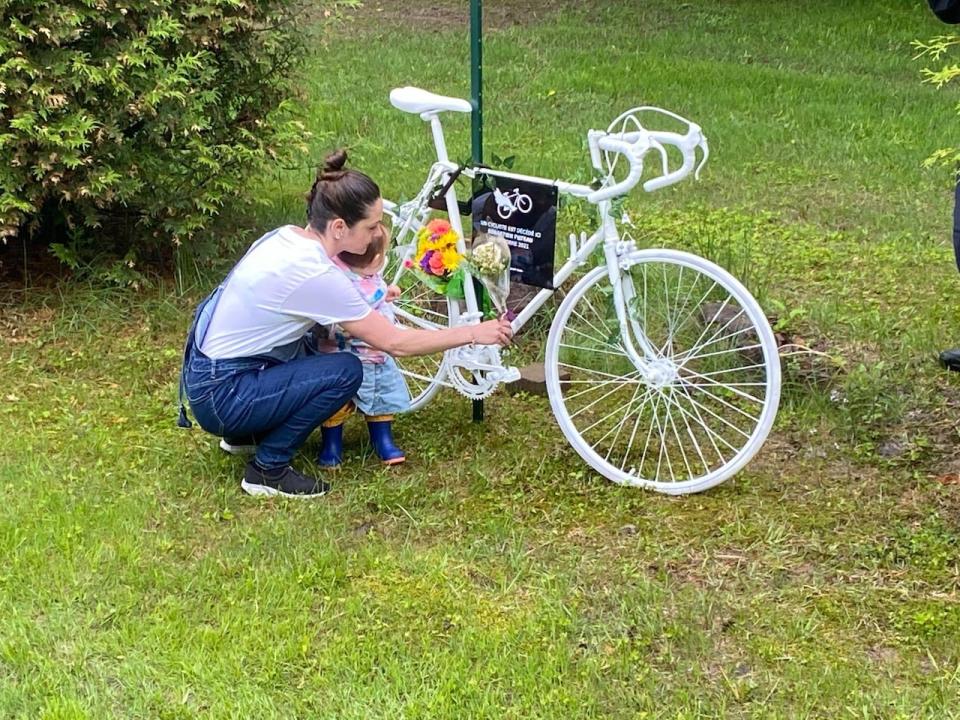 Stéphanie Ménard pictured placing flowers at the 