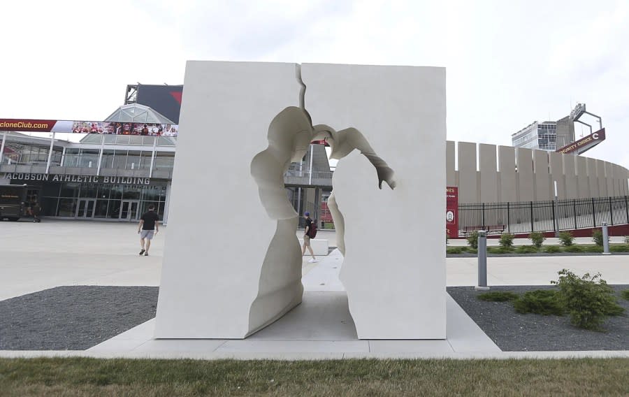 A 100-ton concrete and bronze sculpture, “Breaking Barriers,” is displayed to commemorate the 100th anniversary of Jack Trice’s death, in front of Jack Trice Stadium in 2023 in Ames, Iowa. (Nirmalendu Majumda/Ames Tribune via AP)