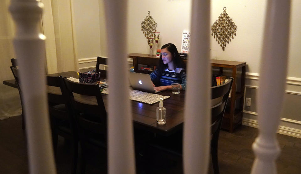 Charvi Goyal, 17, gives an online math tutoring session from her family's home Monday, Jan. 4, 2021, in Plano, Texas. Goyal is part of a group of high school students that put together their own volunteer online tutoring service to help k-12 during the pandemic. (AP Photo/LM Otero)