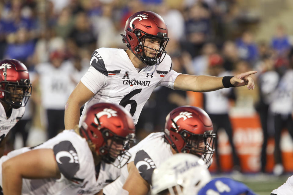 Cincinnati quarterback Ben Bryant calls instructions to teammates during the first half of an NCAA college football game against Tulsa in Tulsa, Okla., Saturday, Oct. 1, 2022. (AP Photo/Dave Crenshaw)