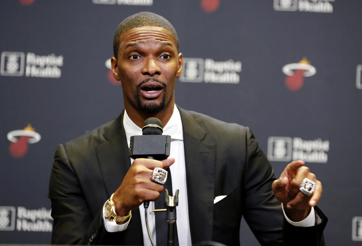 File Photo: Former Miami Heat player Chris Bosh speaks at a press conference before the team's retirement of his jersey at halftime of an NBA game between the Heat and the Orlando Magic, Tuesday, March 26, 2019, in Miami. Bosh played 13 seasons, the first seven in Toronto and the last six in Miami. He averaged 19.2 points and 8.5 rebounds, was an All-Star 11 times and won two championships. (AP Photo/Joe Skipper)