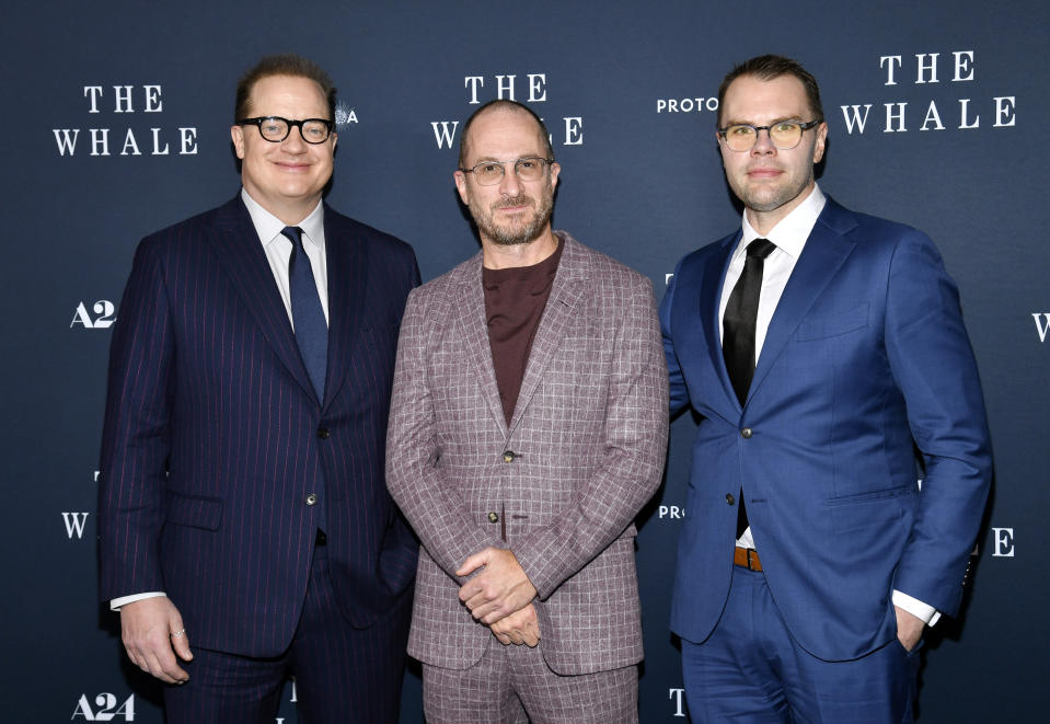 Actor Brendan Fraser, left, director Darren Aronofsky and writer Sam Hunter attend the premiere of "The Whale" at Alice Tully Hall on Tuesday, Nov. 29, 2022, in New York. (Photo by Evan Agostini/Invision/AP)