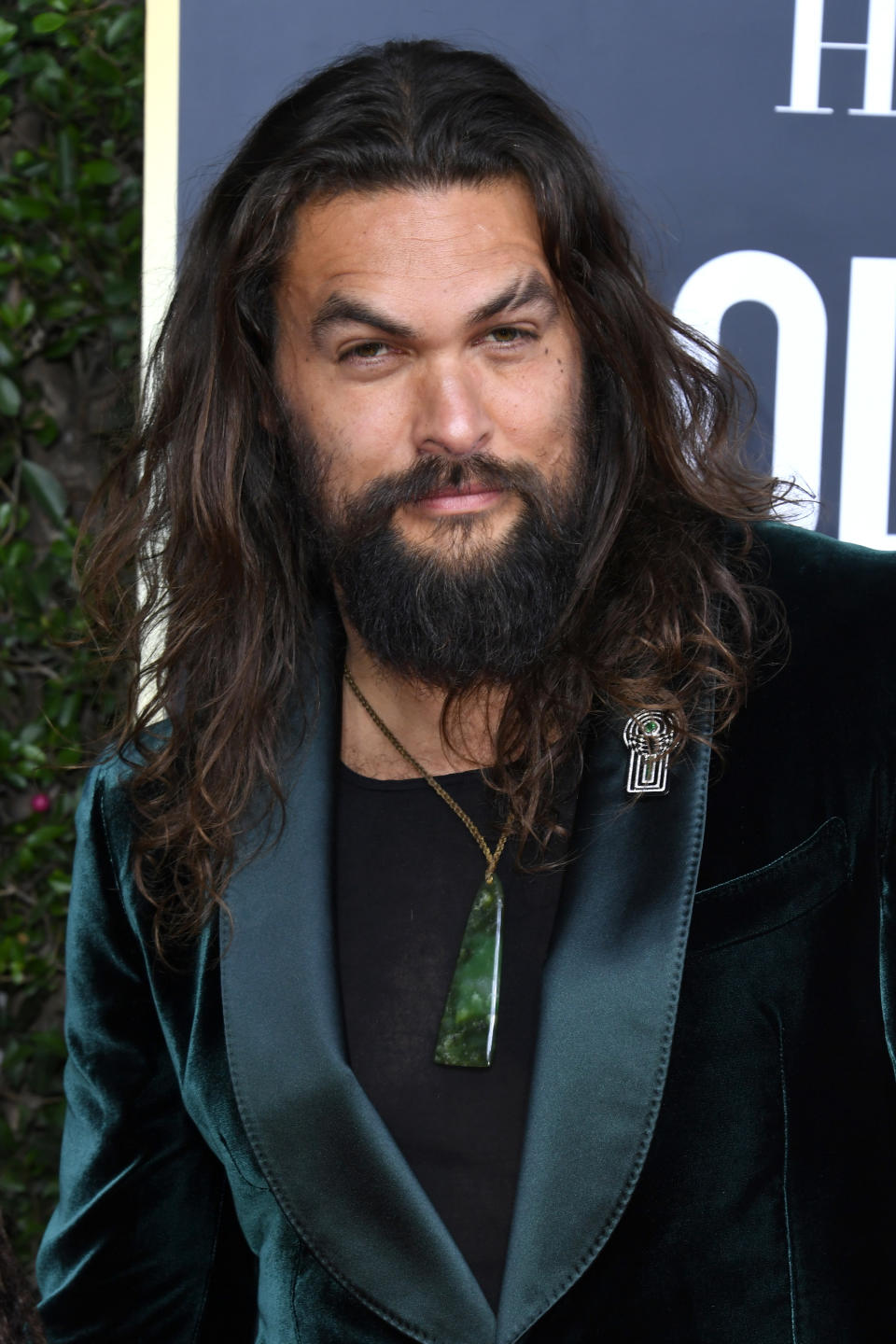 Jason Momoa posing on a red carpet