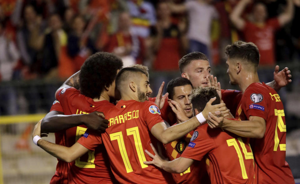 Belgium's team players celebrate after winning a Euro 2020 group I qualifying soccer match between Belgium and Scotland at the King Baudouin Stadium in Brussels, Tuesday, June 11, 2019. (AP Photo/Olivier Matthys)