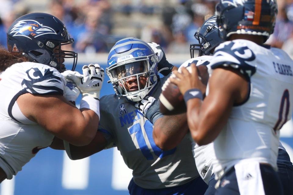 Memphis Tigers defensive lineman Morris Joseph tries to break towards UTSA quarterback FRank Harris at Liberty Bowl Memorial Stadium on Saturday, September 25, 2021.