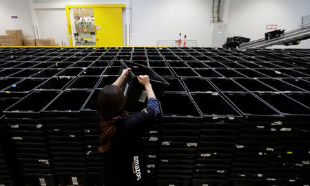 FILE PHOTO: An employee works at the Amazon fulfillment center in the village of Dobroviz, near Prague, Czech Republic, December 20, 2018. REUTERS/David W Cerny/File Photo