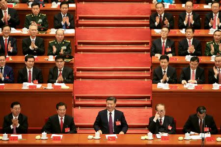 (Front row, L to R) Chairman of the Standing Committee of the National People's Congress (NPC) Zhang Dejiang, former Chinese President Hu Jintao, Chinese President Xi Jinping, former President Jiang Zemin, and Chinese Premier Li Keqiang, are seen during the opening of the 19th National Congress of the Communist Party of China at the Great Hall of the People in Beijing, China October 18, 2017. REUTERS/Aly Song