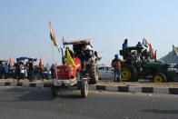 Farmers take part in a tractor rally as they continue to demonstrate against the central government's recent agricultural reforms in New Delhi on January 26, 2021. (Photo by Money SHARMA / AFP) (Photo by MONEY SHARMA/AFP via Getty Images)